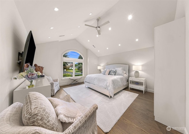 bedroom with ceiling fan, wood-type flooring, and vaulted ceiling