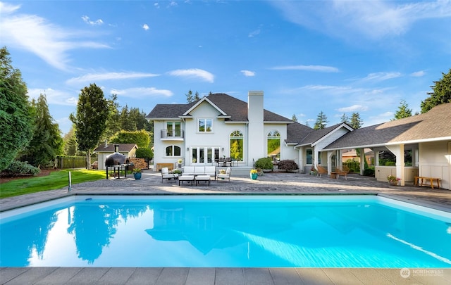 view of pool featuring a patio and an outdoor hangout area