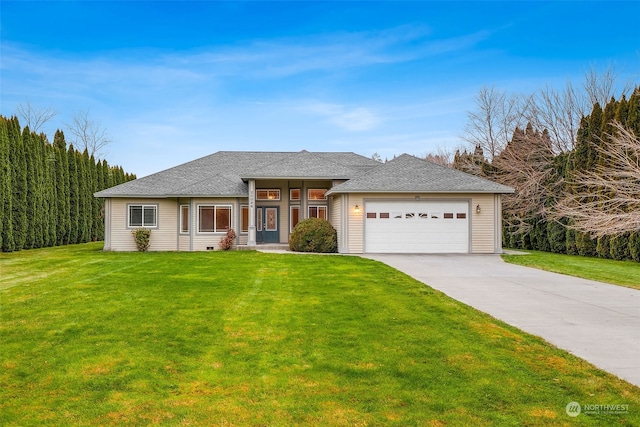 prairie-style house featuring a garage and a front lawn