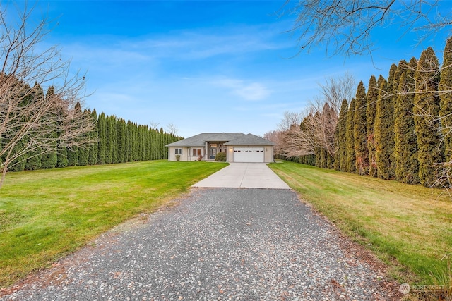 view of front facade with a front lawn and a garage