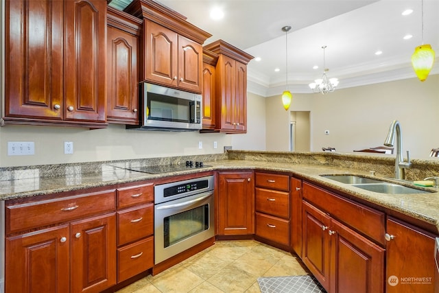 kitchen featuring appliances with stainless steel finishes, ornamental molding, sink, decorative light fixtures, and a notable chandelier