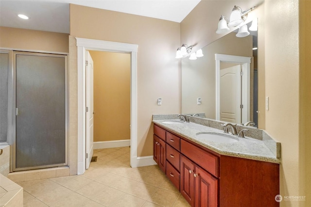 20086 Cherry Rd NW, Soap Lake, WA 98851 - bathroom featuring double vanity, a stall shower, tile patterned flooring, and baseboards