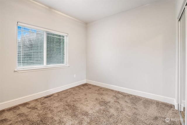 empty room with carpet flooring