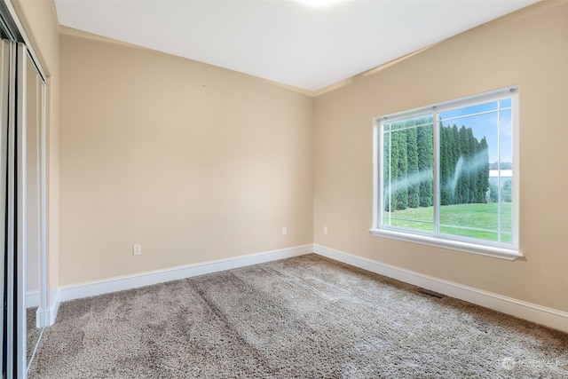 unfurnished room with carpet flooring