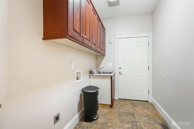 20086 Cherry Rd NW, Soap Lake, WA 98851 - washroom with cabinet space, baseboards, hookup for an electric dryer, hookup for a washing machine, and stone finish floors