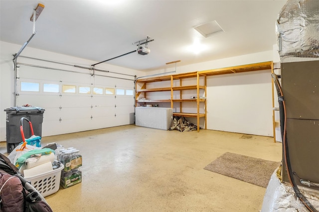 garage with washer / clothes dryer and a garage door opener