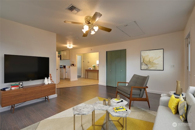 living room with ceiling fan and wood-type flooring