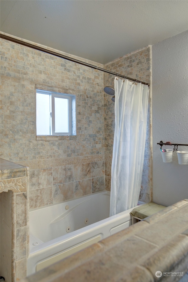 bathroom with shower / bath combo