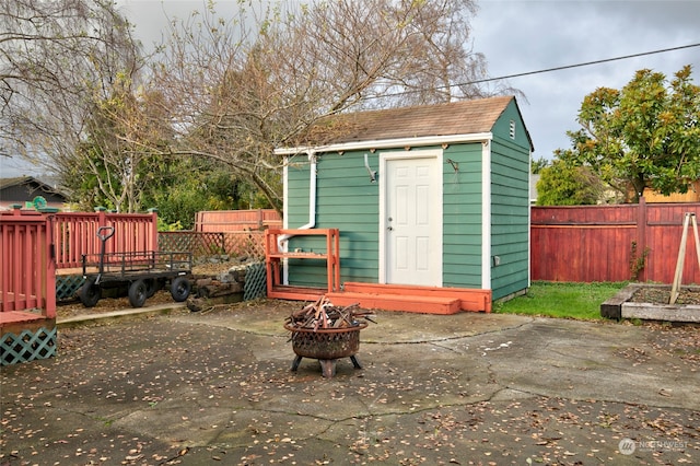 view of outdoor structure with an outdoor fire pit