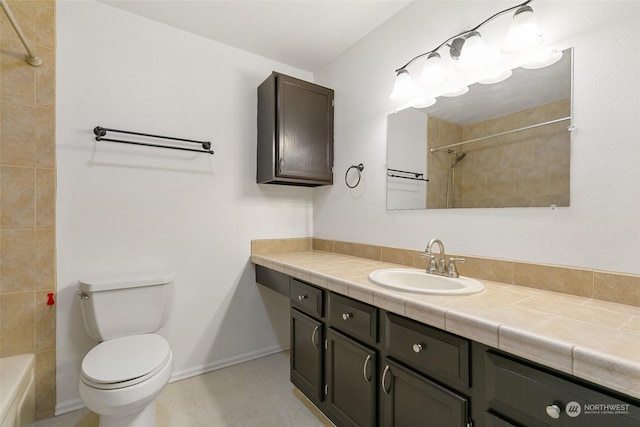 full bathroom featuring vanity, toilet, and tiled shower / bath combo