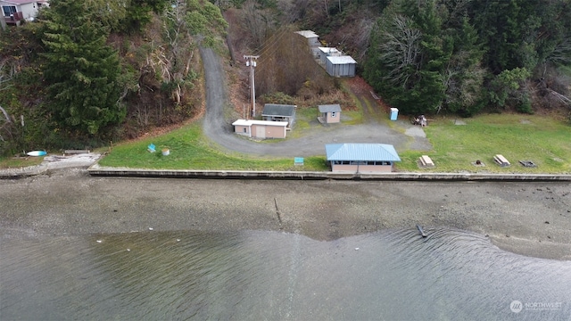 birds eye view of property with a water view