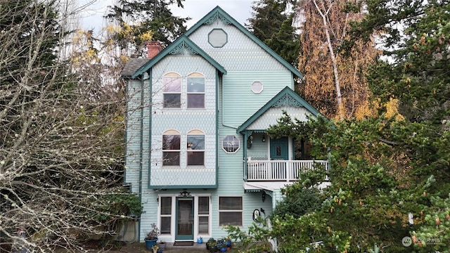 view of front of house featuring a balcony