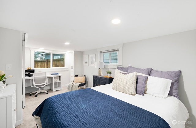 bedroom featuring multiple windows and carpet floors