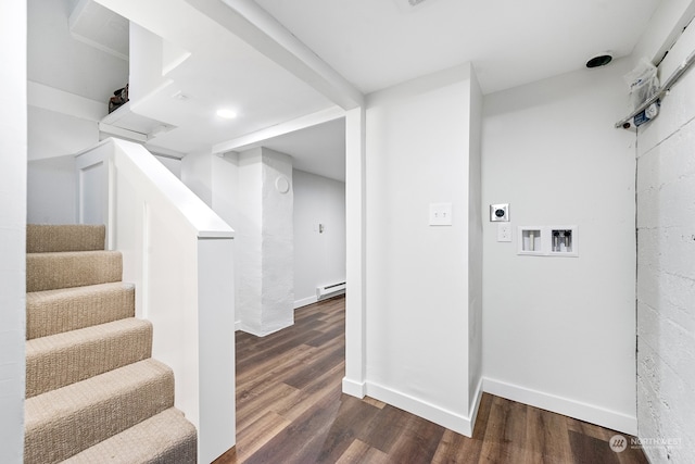 stairs featuring wood-type flooring and a baseboard radiator