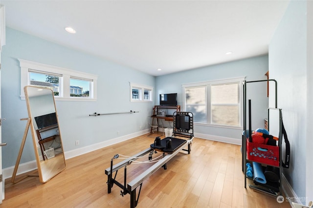 workout area featuring light hardwood / wood-style floors