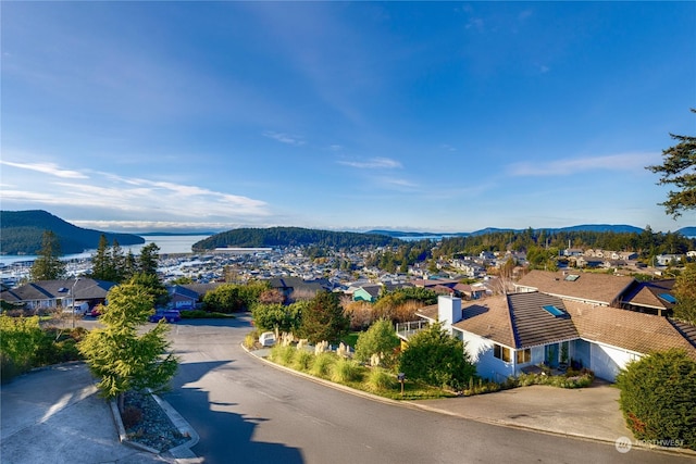 birds eye view of property with a mountain view