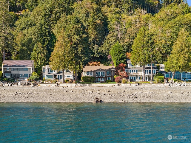 birds eye view of property with a water view