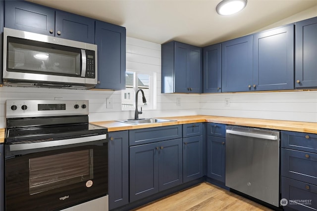 603 Military St, Walla Walla, WA 99362 - kitchen with wood counters, stainless steel appliances, and sink