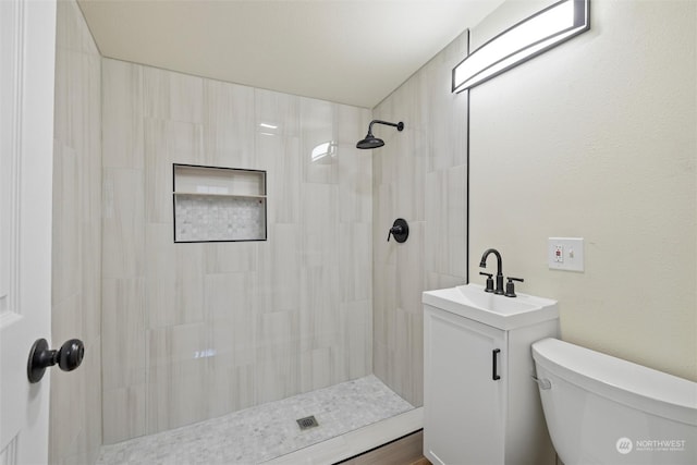 603 Military St, Walla Walla, WA 99362 - bathroom featuring a tile shower, vanity, and toilet