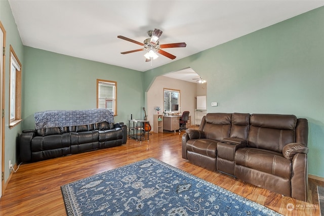 living room with hardwood / wood-style flooring and ceiling fan