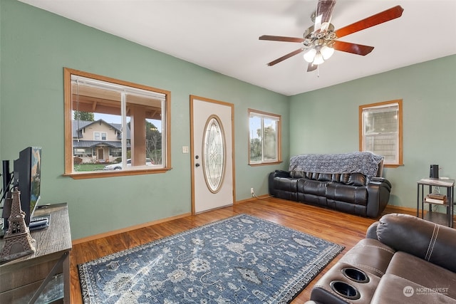 living room with ceiling fan and hardwood / wood-style floors