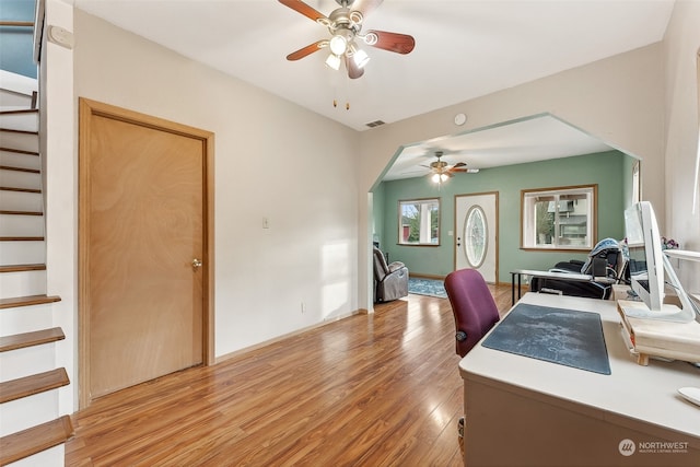 office with ceiling fan and light wood-type flooring