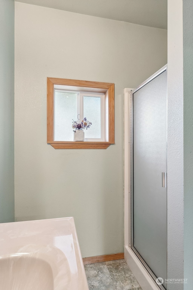 bathroom with an enclosed shower