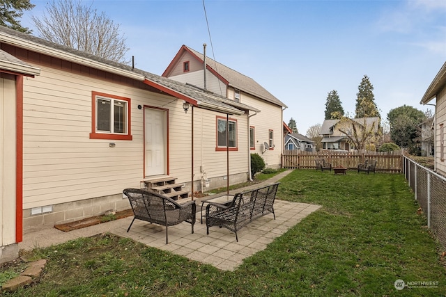 rear view of house featuring a patio area and a lawn