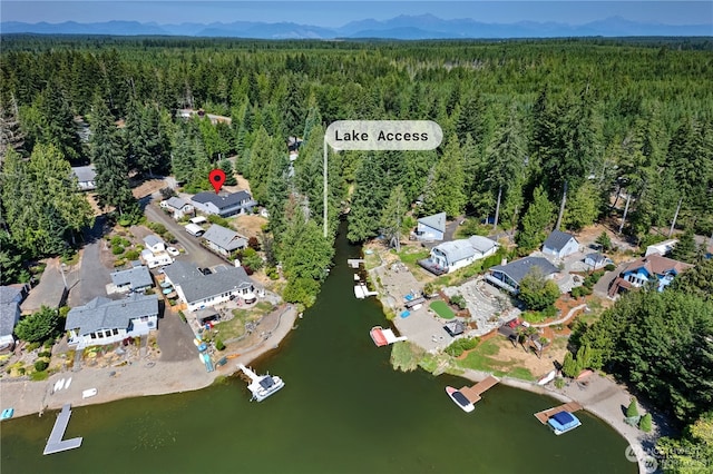 drone / aerial view with a water and mountain view