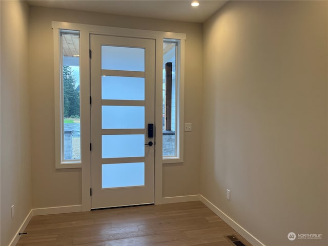 doorway featuring light hardwood / wood-style floors