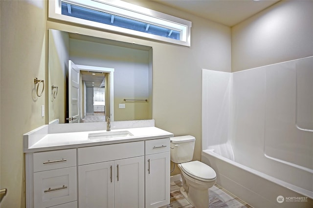 full bathroom with vanity, shower / bath combination, and toilet