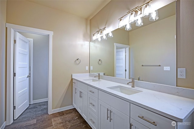 bathroom with hardwood / wood-style floors and vanity