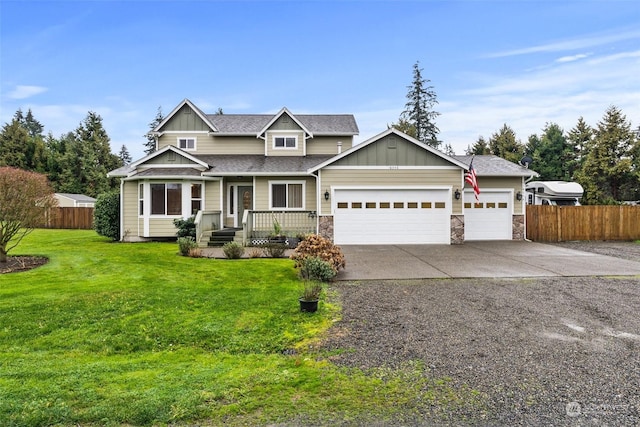 craftsman-style house featuring a garage and a front lawn