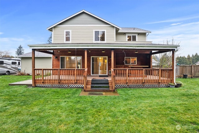 view of front of property featuring a wooden deck and a front lawn