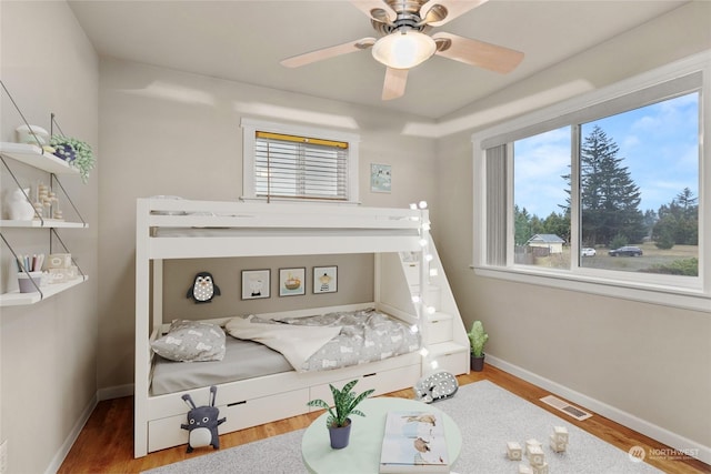 bedroom featuring wood-type flooring and ceiling fan