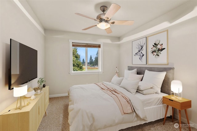 bedroom featuring ceiling fan and light carpet