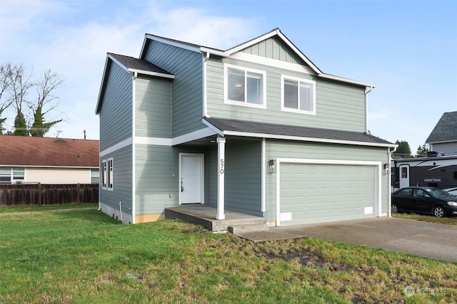 view of front of property featuring a garage and a front yard