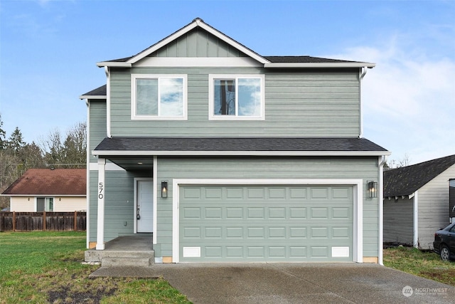 view of front of home with a garage and a front yard