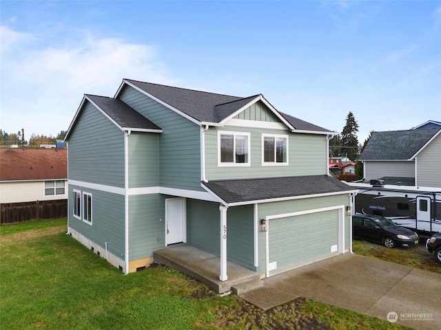 view of front facade with a garage and a front lawn