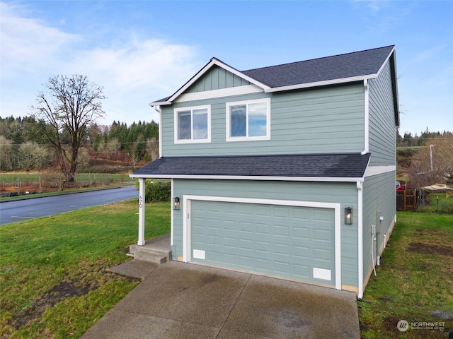 view of front facade with a garage and a front lawn