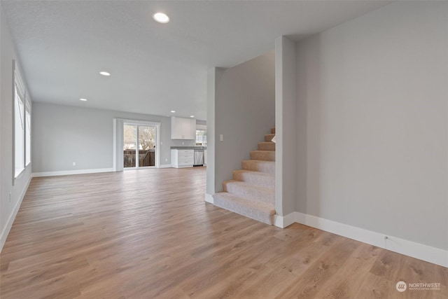 unfurnished living room with light wood-type flooring