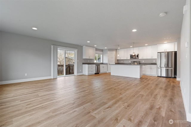 unfurnished living room featuring light hardwood / wood-style floors