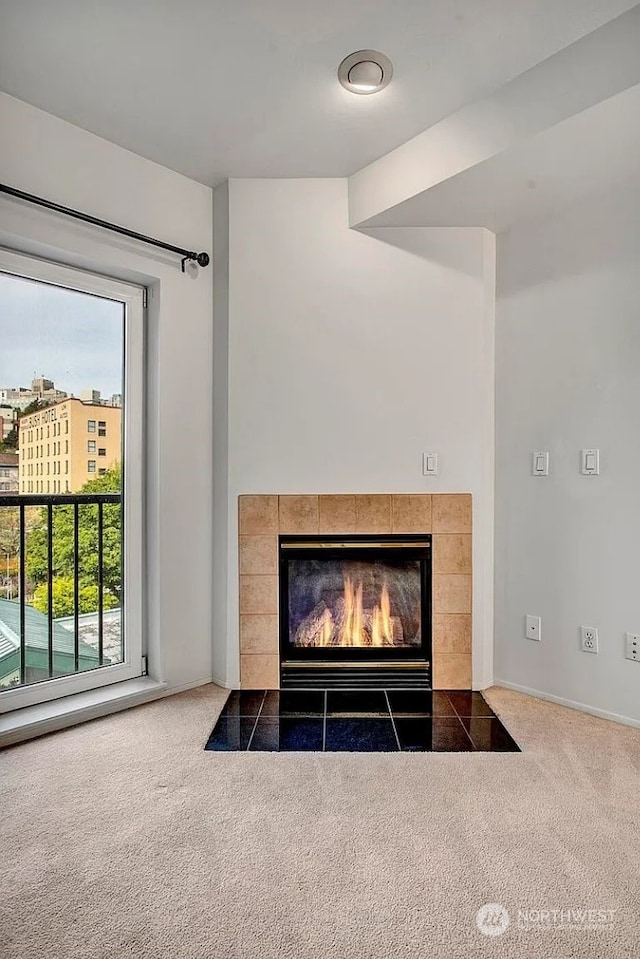 room details featuring carpet floors and a fireplace