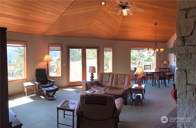 living room featuring carpet, wood ceiling, and a healthy amount of sunlight