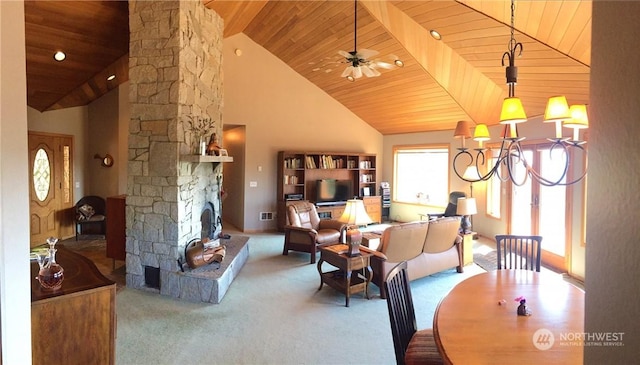 carpeted dining space featuring wooden ceiling, a stone fireplace, and high vaulted ceiling