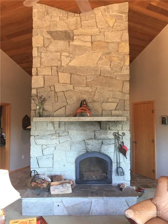 room details with wood ceiling and a stone fireplace