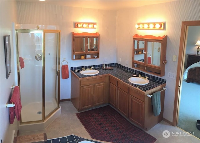 bathroom with an enclosed shower and vanity