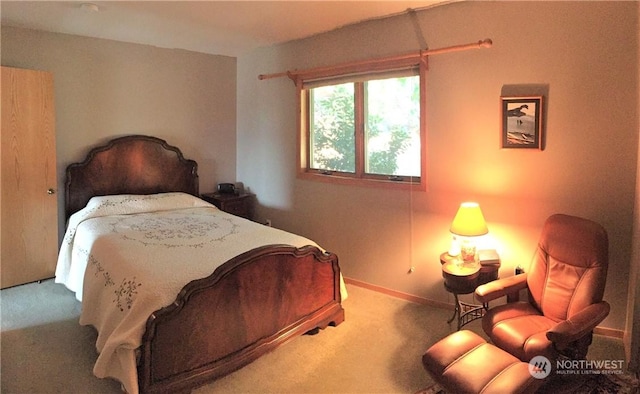 bedroom featuring light colored carpet