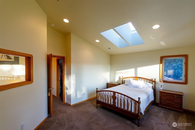 bedroom with dark carpet, high vaulted ceiling, and a skylight