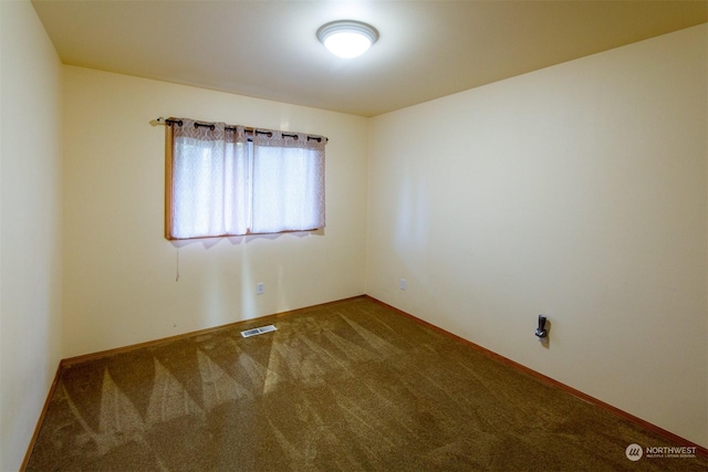 spare room featuring carpet floors